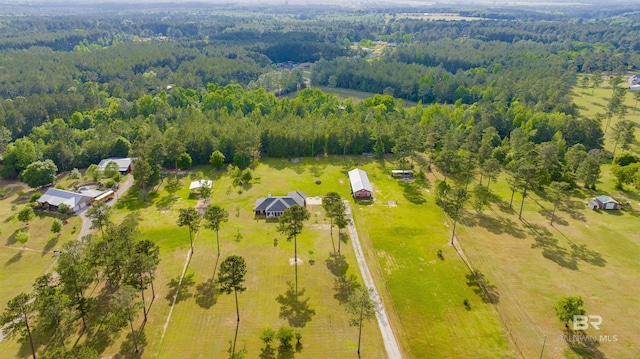 drone / aerial view with a view of trees