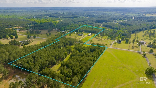 aerial view with a rural view and a wooded view