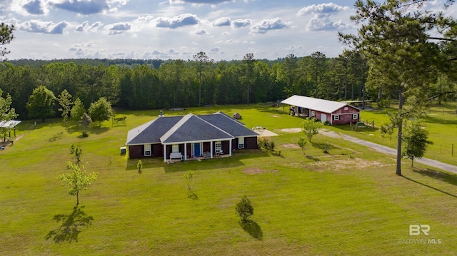 drone / aerial view with a view of trees