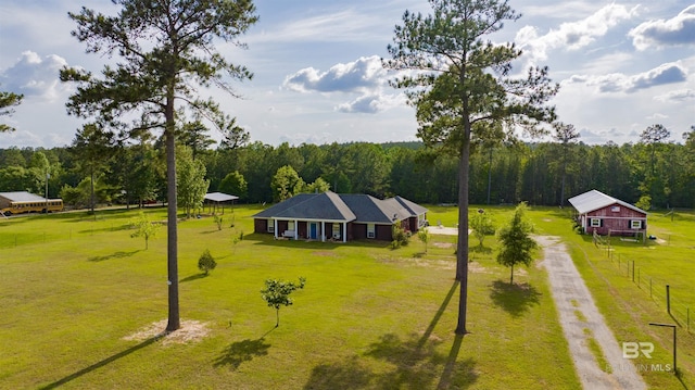 aerial view featuring a wooded view
