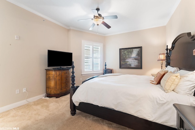 carpeted bedroom featuring crown molding and ceiling fan