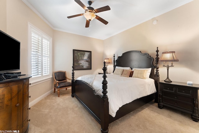 carpeted bedroom featuring ornamental molding and ceiling fan