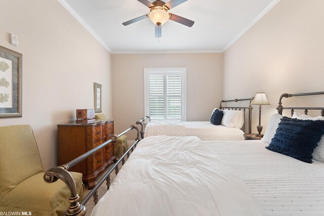 bedroom with ceiling fan and crown molding