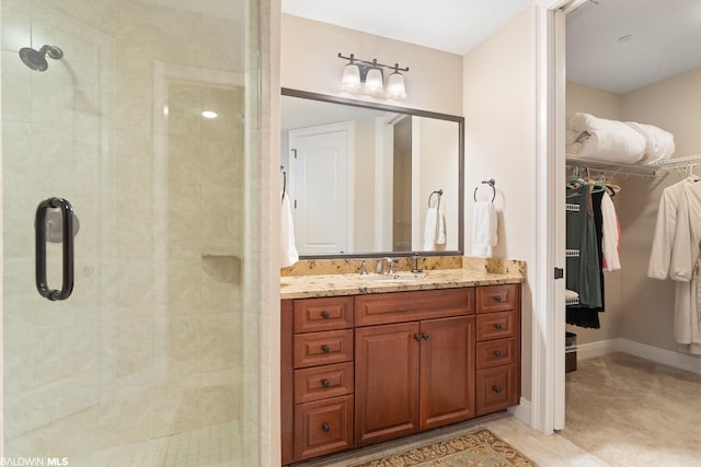 bathroom featuring vanity and walk in shower