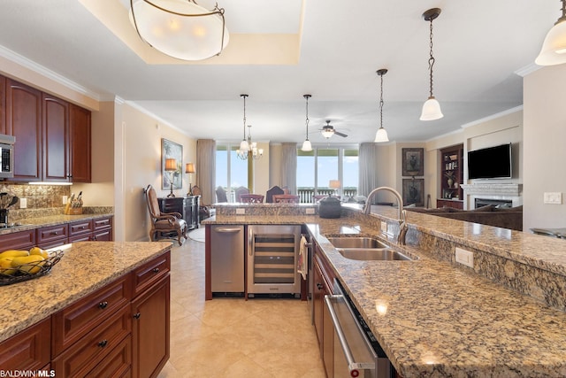 kitchen featuring sink, light tile floors, wine cooler, decorative light fixtures, and ceiling fan with notable chandelier