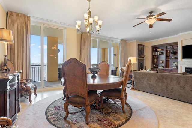 tiled dining space featuring ornamental molding and ceiling fan with notable chandelier