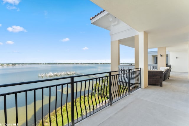 balcony featuring a water view