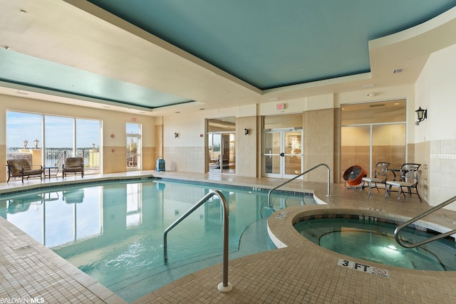 view of pool featuring an indoor hot tub