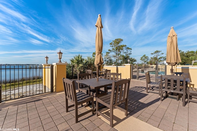 view of patio / terrace featuring a water view