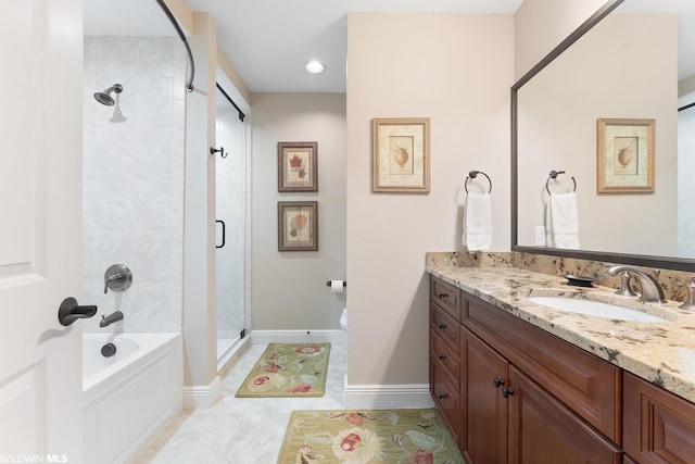 bathroom featuring tile floors, toilet, and vanity