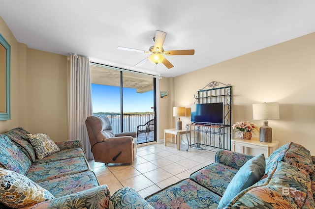 living room with light tile patterned floors and ceiling fan