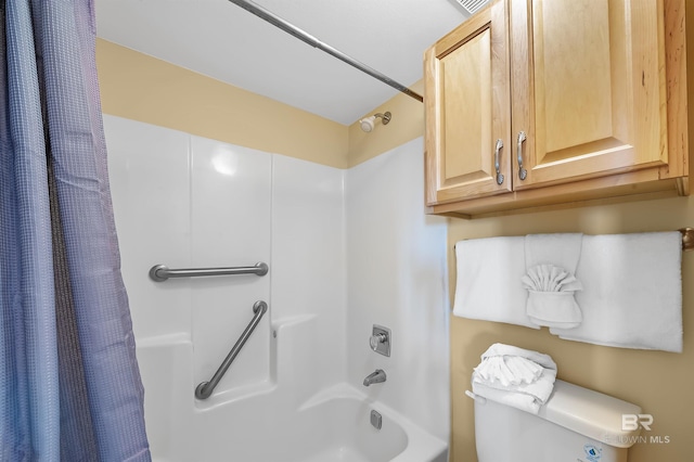 full bathroom with toilet and shower / tub combo with curtain