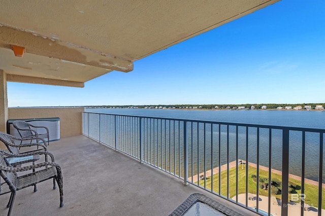 balcony featuring a water view