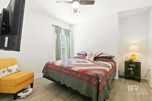 bedroom featuring ceiling fan and wood-type flooring