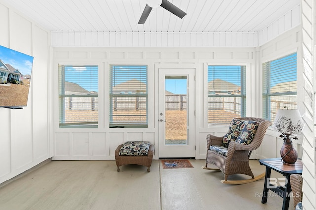 sunroom / solarium with ceiling fan