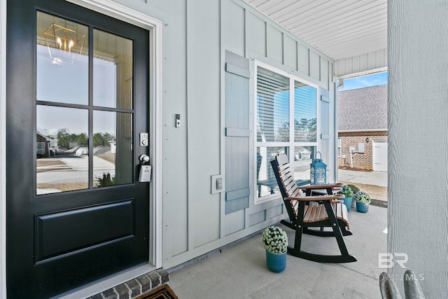 view of exterior entry featuring a porch