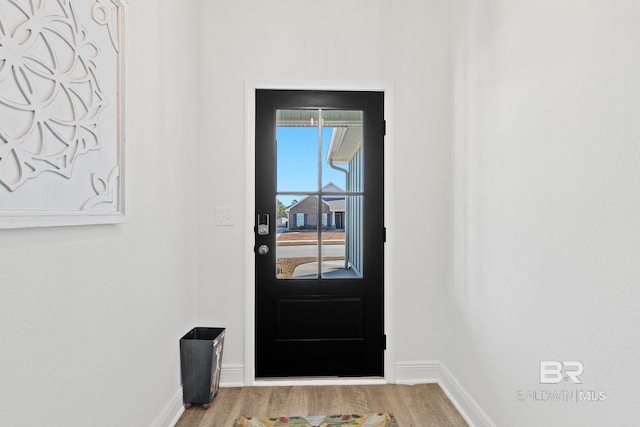 doorway to outside with hardwood / wood-style flooring