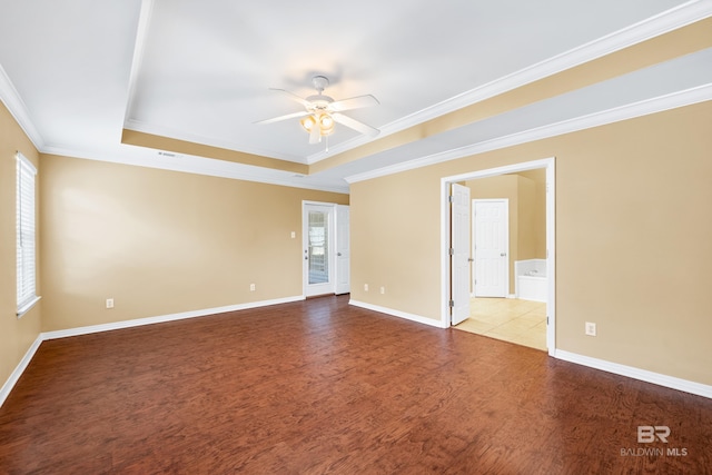 unfurnished room with ceiling fan, light hardwood / wood-style flooring, crown molding, and a tray ceiling