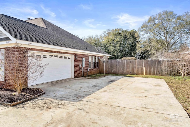 view of property exterior with a garage