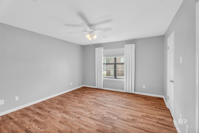 spare room featuring ceiling fan and light wood-type flooring