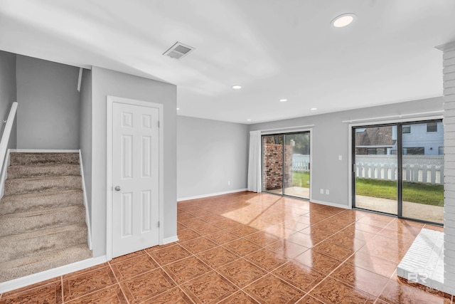 unfurnished room featuring tile patterned floors