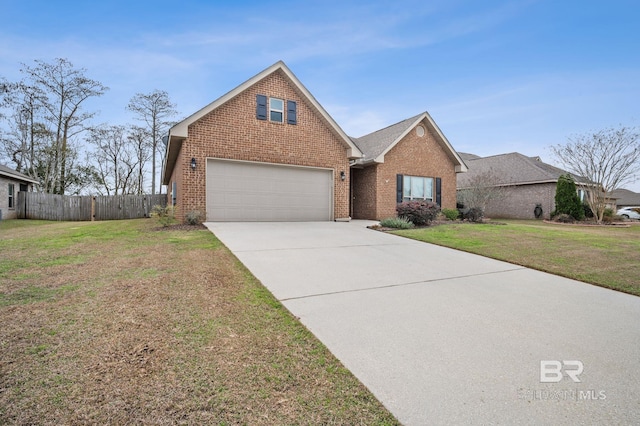 traditional-style home featuring concrete driveway, brick siding, a front yard, and fence