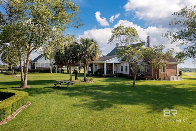 24235 County Road 87, Robertsdale, AL 36567 - view of grassy yard with central AC