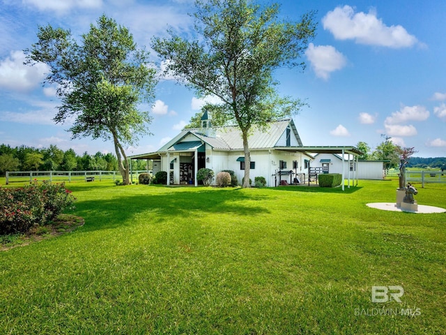 24235 County Road 87, Robertsdale, AL 36567 - rear view of house featuring metal roof