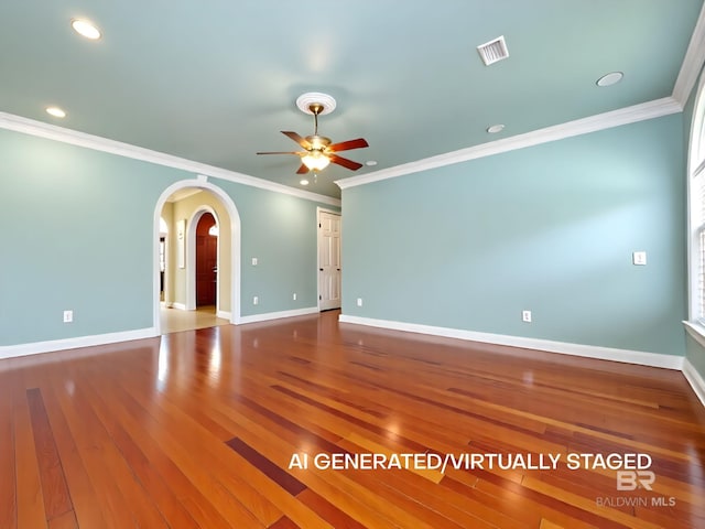 24235 County Road 87, Robertsdale, AL 36567 - empty room featuring a ceiling fan, arched walkways, ornamental molding, hardwood / wood-style flooring, and baseboards
