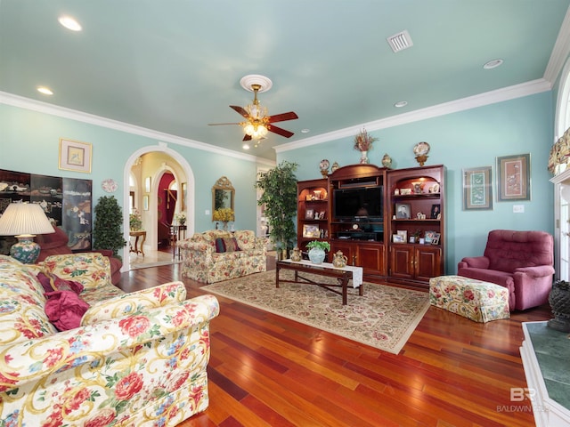 24235 County Road 87, Robertsdale, AL 36567 - living area with arched walkways, a ceiling fan, wood finished floors, crown molding, and recessed lighting