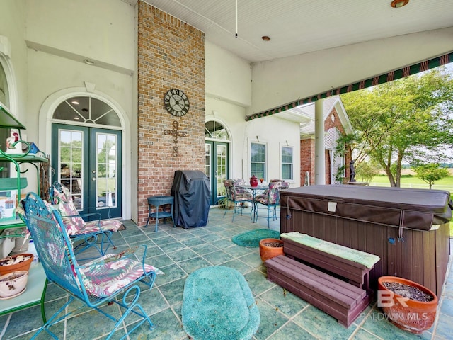 24235 County Road 87, Robertsdale, AL 36567 - view of patio / terrace featuring a hot tub and french doors