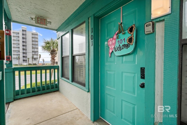 doorway to property with a porch