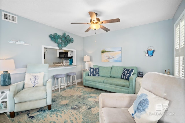 living room featuring ceiling fan