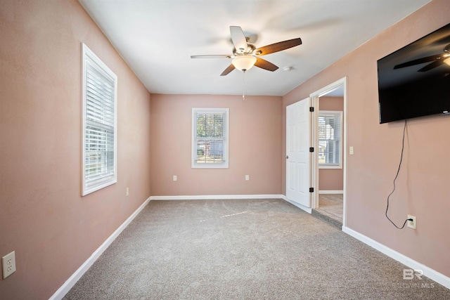 carpeted empty room with ceiling fan