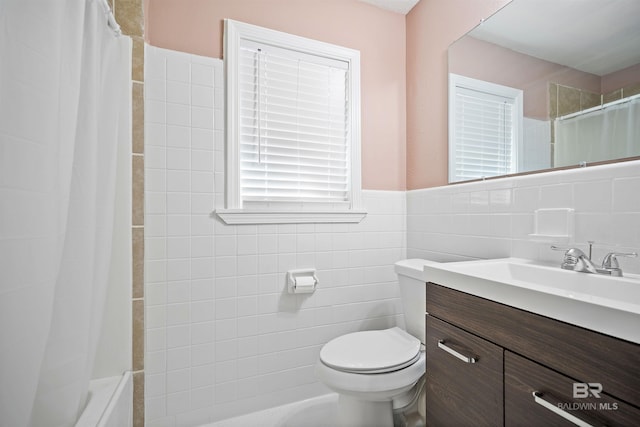 bathroom featuring vanity, walk in shower, tile walls, and toilet