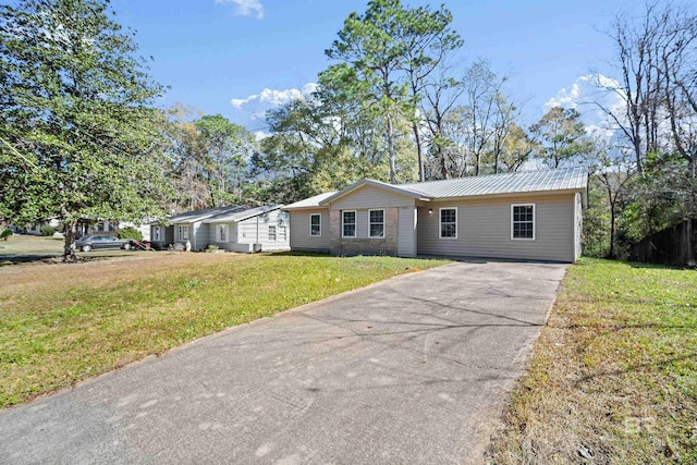 ranch-style home with a front lawn