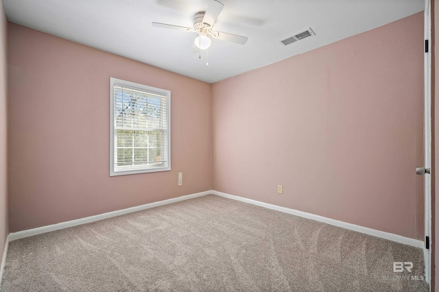 empty room with carpet flooring and ceiling fan