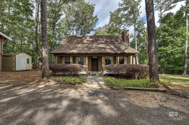 31375 Stagecoach Rd, Spanish Fort, AL 36527 - cape cod-style house featuring a chimney and a porch