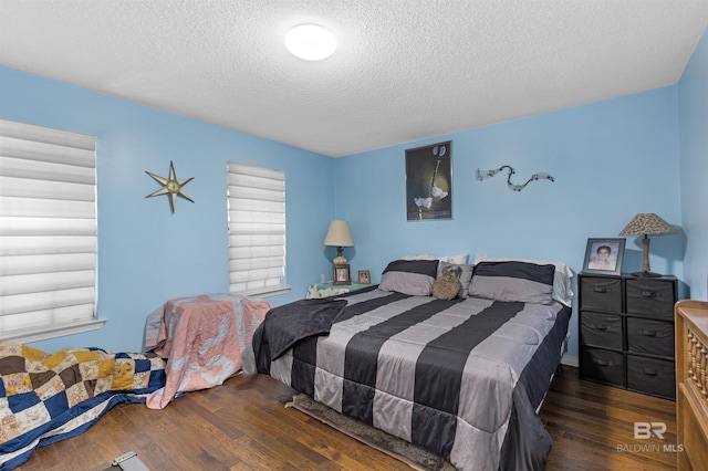 31375 Stagecoach Rd, Spanish Fort, AL 36527 - bedroom featuring a textured ceiling and wood finished floors