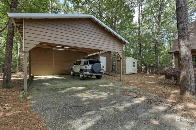 31375 Stagecoach Rd, Spanish Fort, AL 36527 - view of parking / parking lot with a shed and asphalt driveway