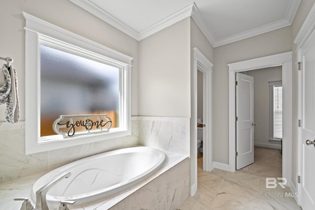 bathroom with tiled bath, toilet, and ornamental molding