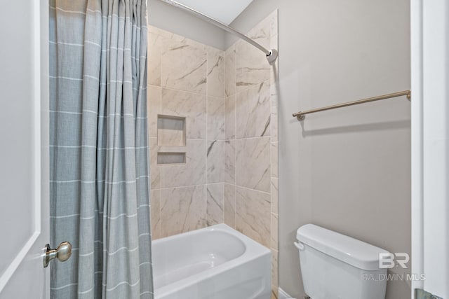 bathroom with toilet and shower / bath combo