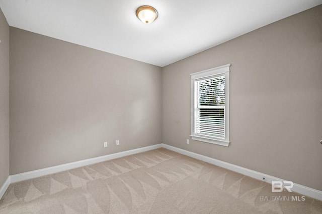 empty room with light colored carpet