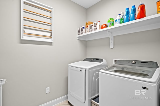 clothes washing area featuring washer and clothes dryer