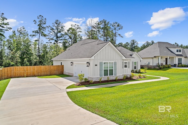 view of front facade with a garage and a front lawn