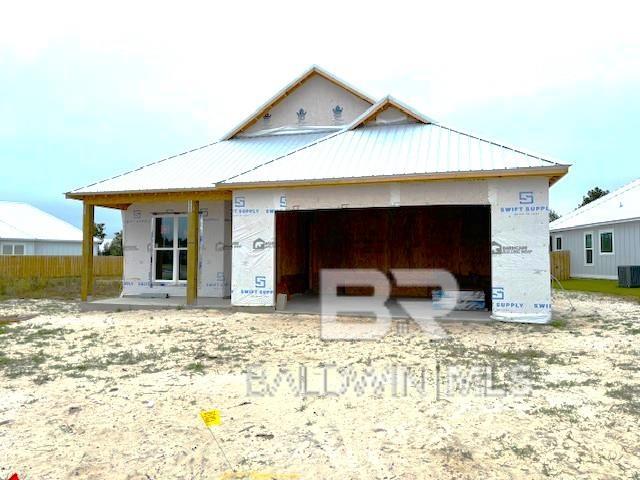 exterior space with a garage and central AC