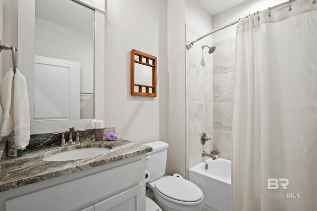 bathroom with shower / bathtub combination with curtain, toilet, and vanity