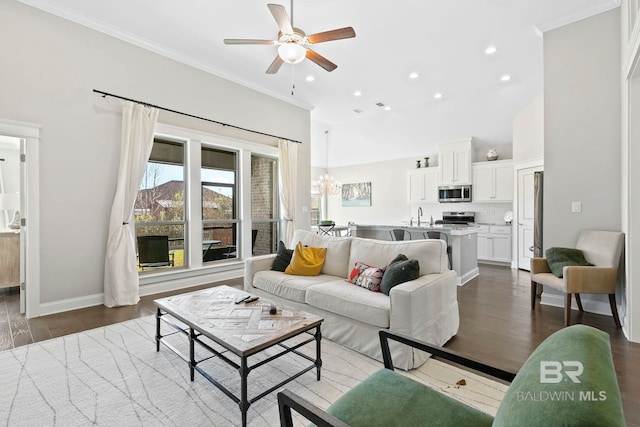 living area with dark wood-style floors, recessed lighting, crown molding, and baseboards