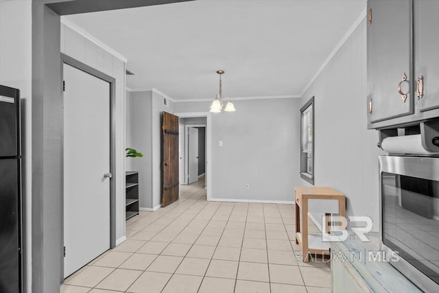 4918 Quimby Dr, Mobile, AL 36619 - kitchen featuring stainless steel microwave, ornamental molding, a chandelier, baseboards, and freestanding refrigerator