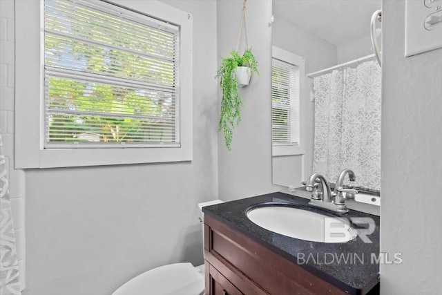4918 Quimby Dr, Mobile, AL 36619 - bathroom with vanity, toilet, and curtained shower